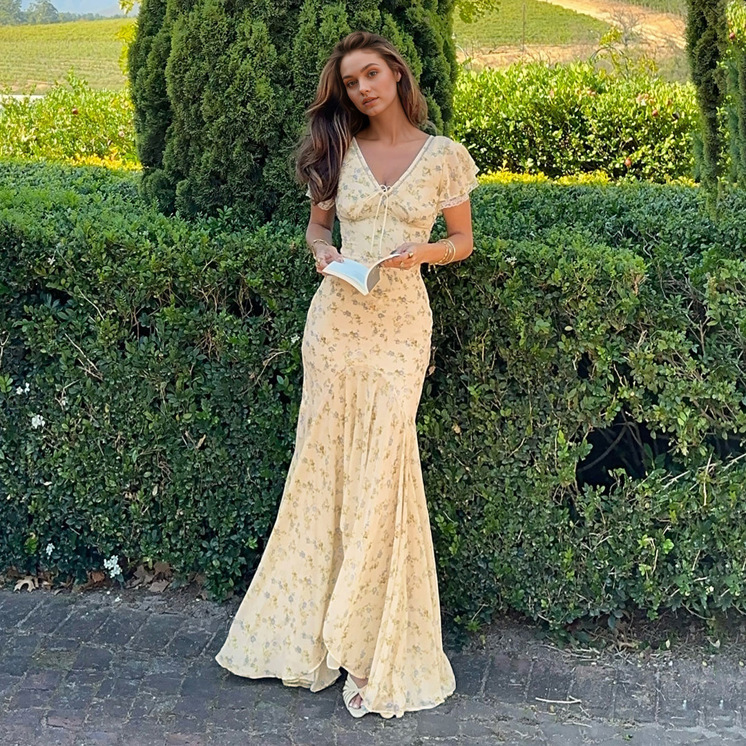 Damer elegant maxiklänning med blommönster och volangdetaljer Mirla-Eva Jonsson