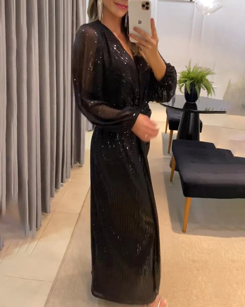 Damer elegant maxiklänning med glittrande detaljer och raffinerad V-ringning Mirla-Eva Jonsson