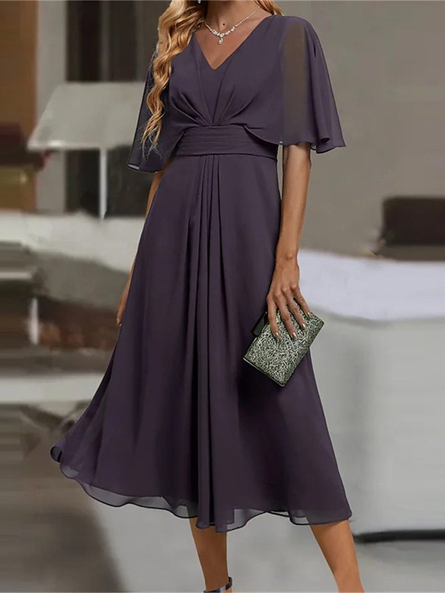 Damer elegant midikjol med flödande tyg och asymmetriska ärmar Eva Jonsson-Eva Jonsson