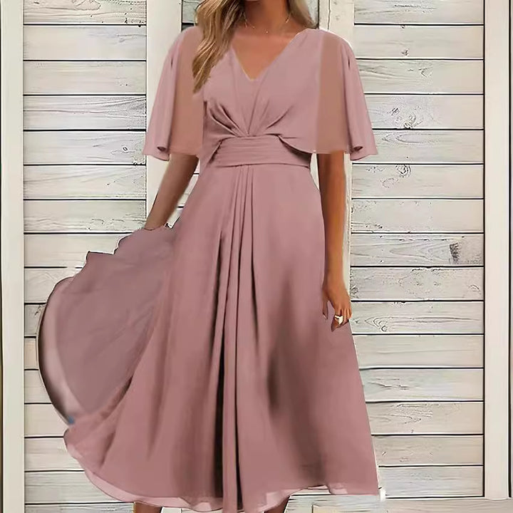 Damer elegant midikjol med flödande tyg och asymmetriska ärmar Eva Jonsson-Eva Jonsson