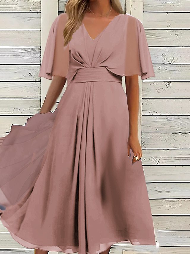 Damer elegant midikjol med flödande tyg och asymmetriska ärmar Eva Jonsson-Eva Jonsson