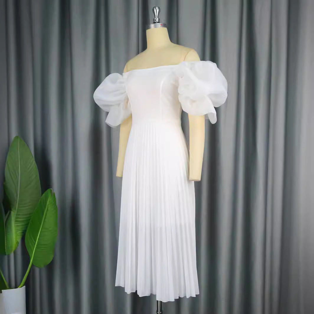 Damer elegant midiklänning med puffärmar och plisserad kjol Mirla-Eva Jonsson