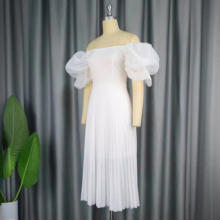 Damer elegant midiklänning med puffärmar och plisserad kjol Mirla-Eva Jonsson
