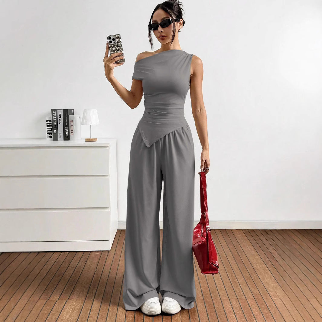 Damer elegant och avslappnad jumpsuit-set med asymmetrisk skärning och breda ben Mirla-Eva Jonsson