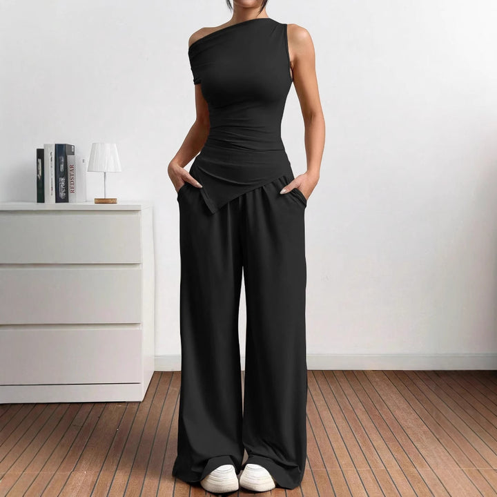 Damer elegant och avslappnad jumpsuit-set med asymmetrisk skärning och breda ben Mirla-Eva Jonsson