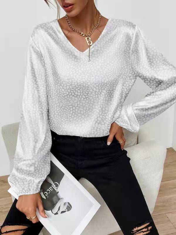 Damer elegant och skimrande topp med V-ringning Mirla-Eva Jonsson