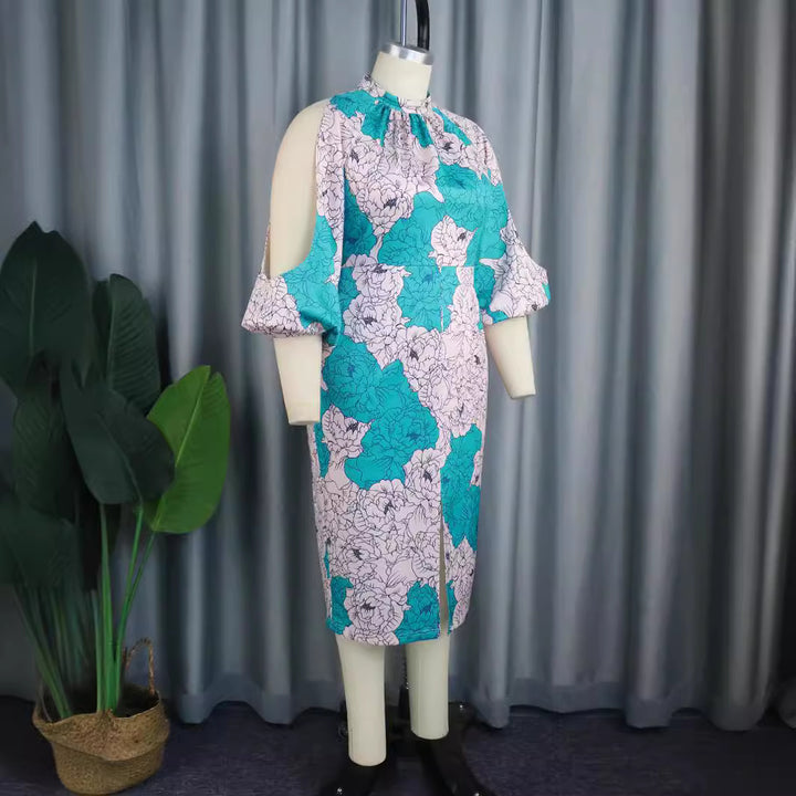 Damer elegant omslagsklänning med blommönster och moderiktiga cut-out ärmar Mirla-Eva Jonsson