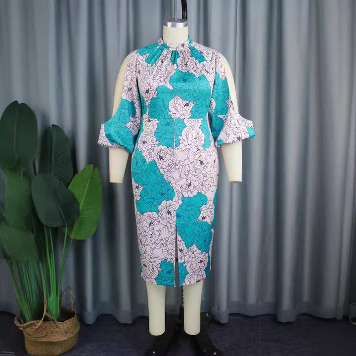 Damer elegant omslagsklänning med blommönster och moderiktiga cut-out ärmar Mirla-Eva Jonsson
