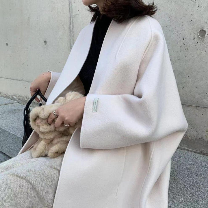Damer elegant oversized kapp med djup krage och praktiska fickor Mirla-Eva Jonsson