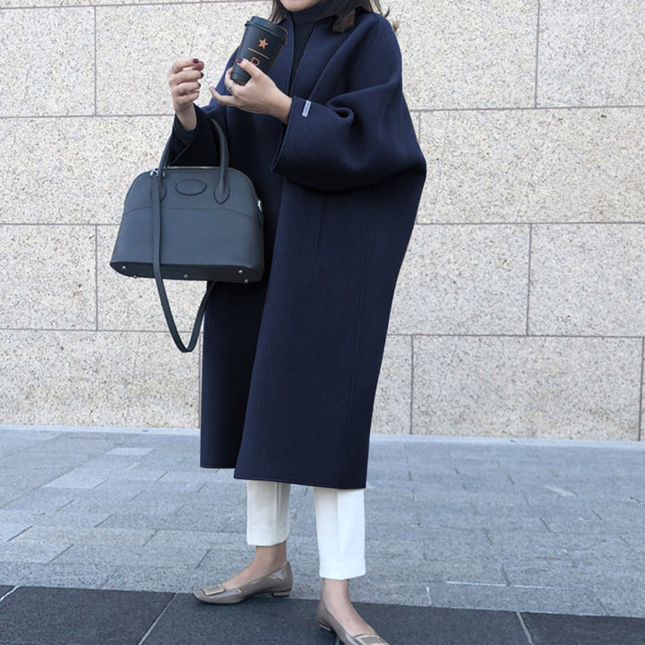 Damer elegant oversized kapp med djup krage och praktiska fickor Mirla-Eva Jonsson