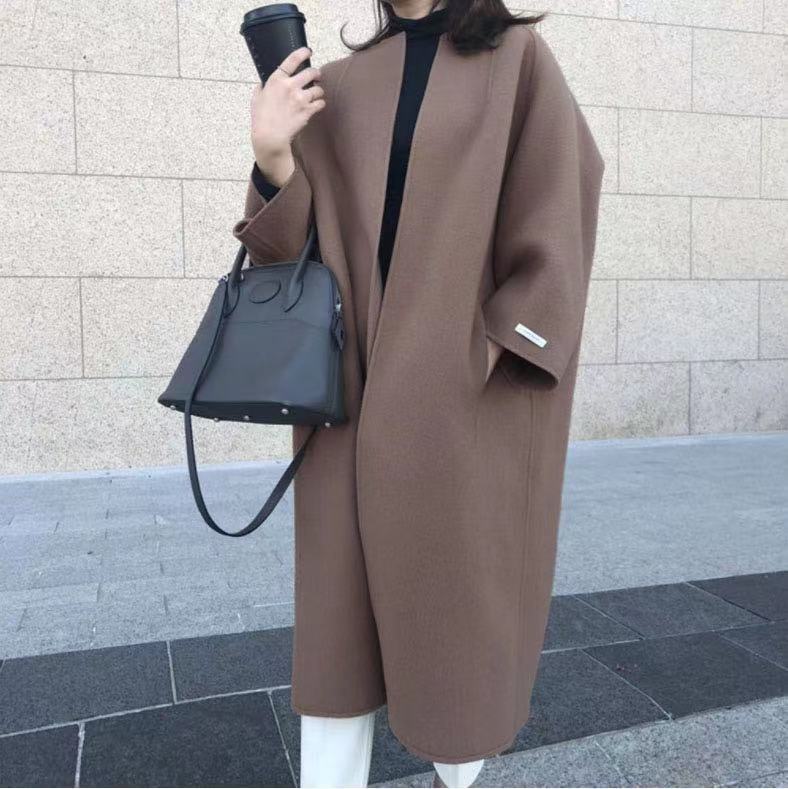 Damer elegant oversized kapp med djup krage och praktiska fickor Mirla-Eva Jonsson