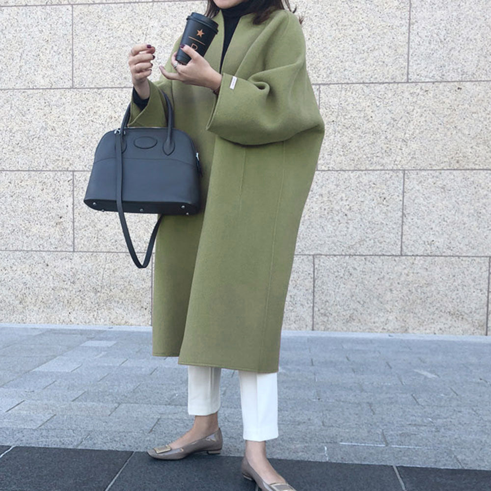 Damer elegant oversized kapp med djup krage och praktiska fickor Mirla-Eva Jonsson
