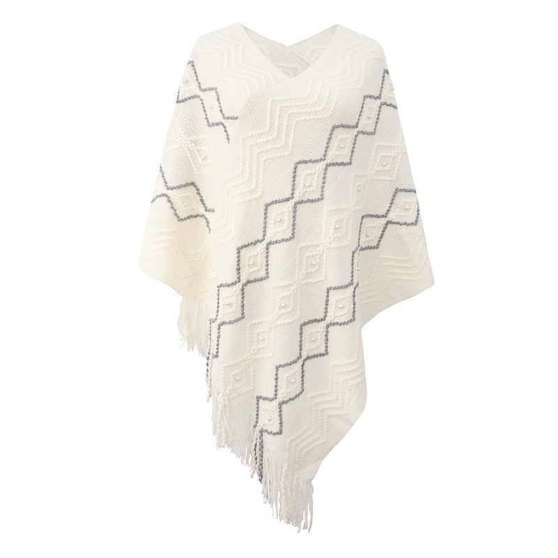 Damer elegant poncho med iögonfallande strukturmönster och dekorativa fransar Mirla-Eva Jonsson