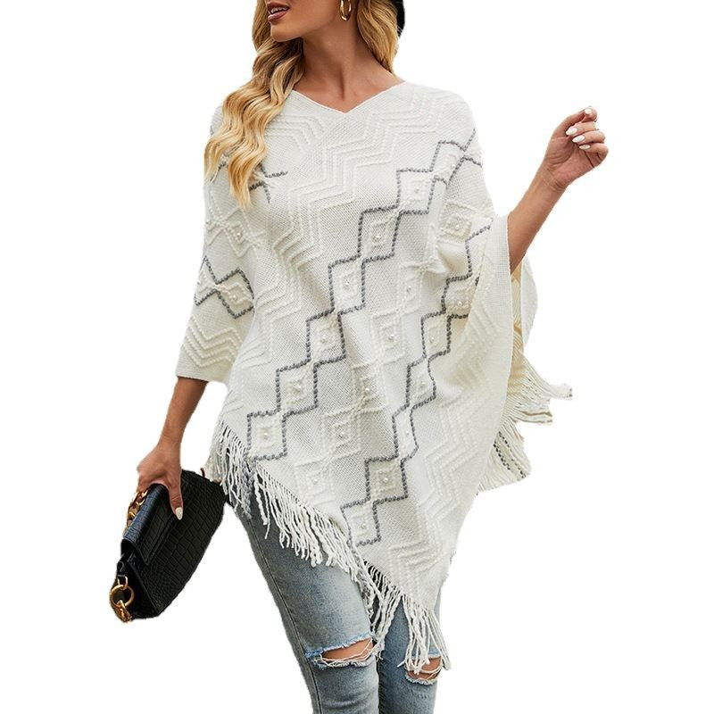 Damer elegant poncho med iögonfallande strukturmönster och dekorativa fransar Mirla-Eva Jonsson