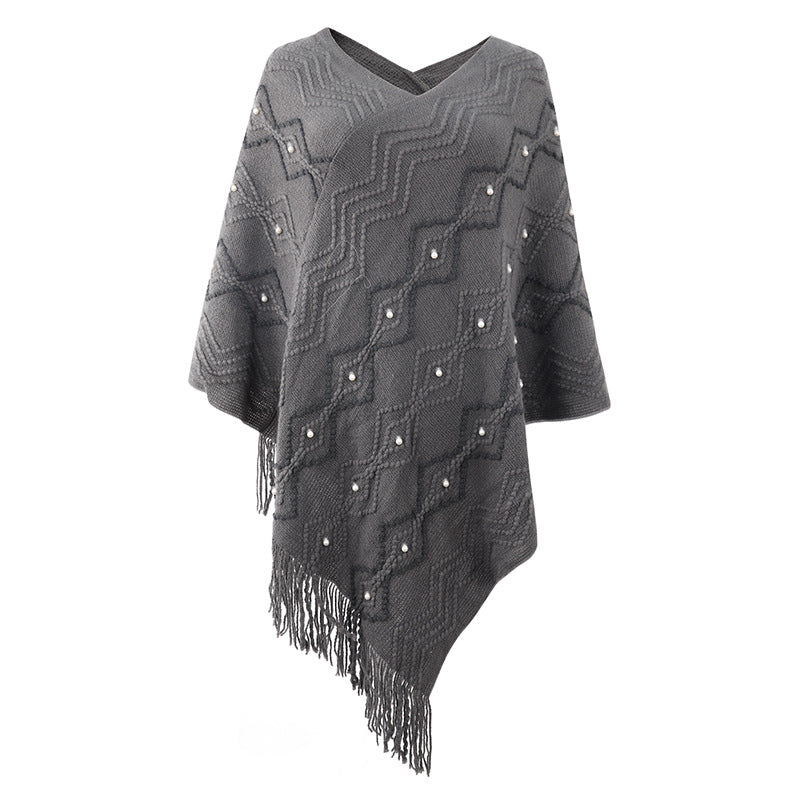 Damer elegant poncho med iögonfallande strukturmönster och dekorativa fransar Mirla-Eva Jonsson