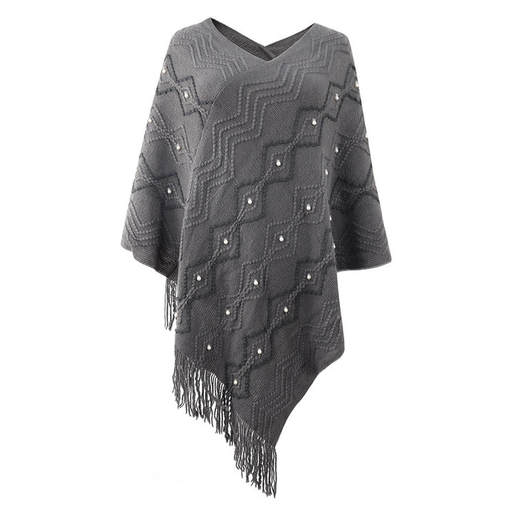 Damer elegant poncho med iögonfallande strukturmönster och dekorativa fransar Mirla-Eva Jonsson