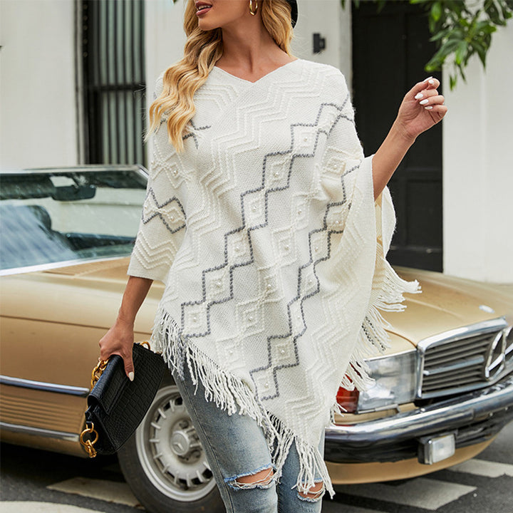 Damer elegant poncho med iögonfallande strukturmönster och dekorativa fransar Mirla-Eva Jonsson