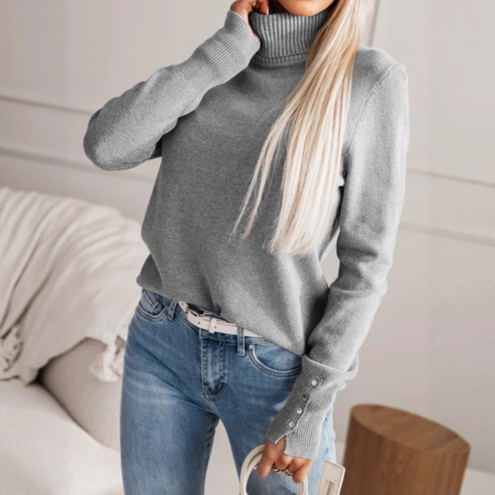 Damer elegant rullkragepolo med knapppdetaljer Mirla-Eva Jonsson
