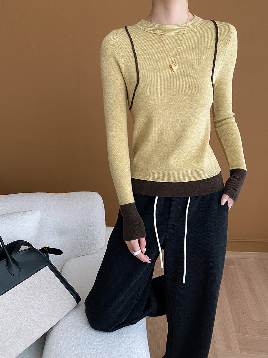 Damer elegant rundhalsad tröja med kontrasterande ärmar och fin ribbad textur Mirla-Eva Jonsson
