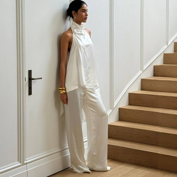 Damer elegant satinert overall med asymmetrisk snitt Mirla-Eva Jonsson
