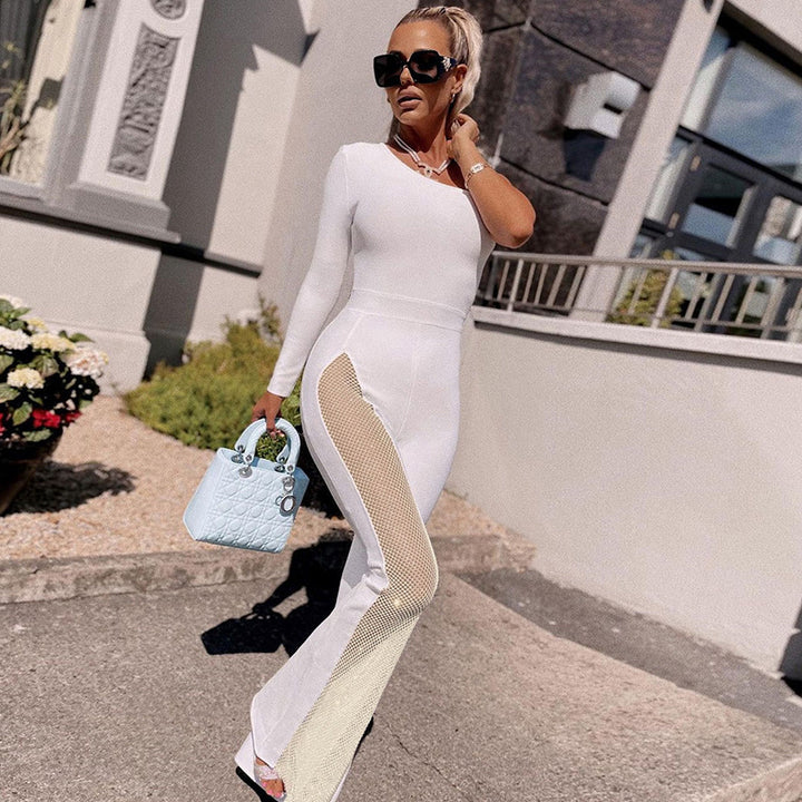 Damer elegant sport jumpsuit med asymmetrisk snitt och mesh-inlägg Mirla-Eva Jonsson
