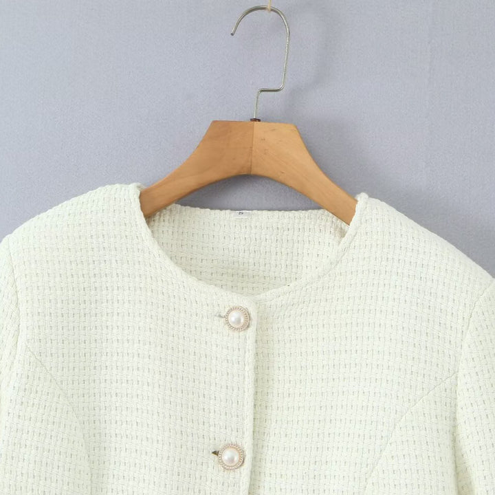 Damer elegant stickad jacka med strukturerad design och pärlknappar Mirla-Eva Jonsson