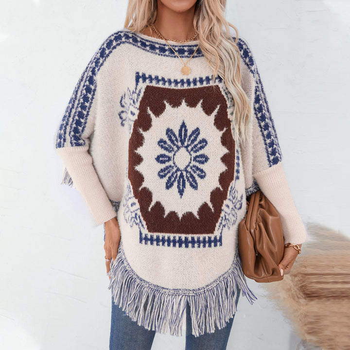 Damer elegant stickad poncho med konstfullt mönster och fransig avslutning Mirla-Eva Jonsson