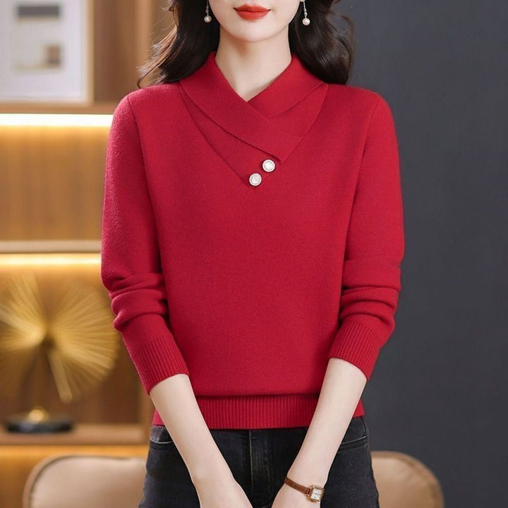 Damer elegant stickad pullover med chic V-hals och dekorativa knappdetaljer Mirla-Eva Jonsson