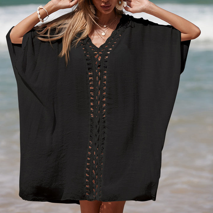 Damer elegant strandponcho med raffinerade virkadetaljer och djup V-urringning Mirla-Eva Jonsson