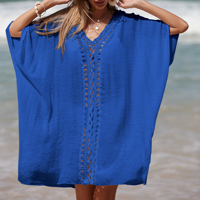 Damer elegant strandponcho med raffinerade virkadetaljer och djup V-urringning Mirla-Eva Jonsson