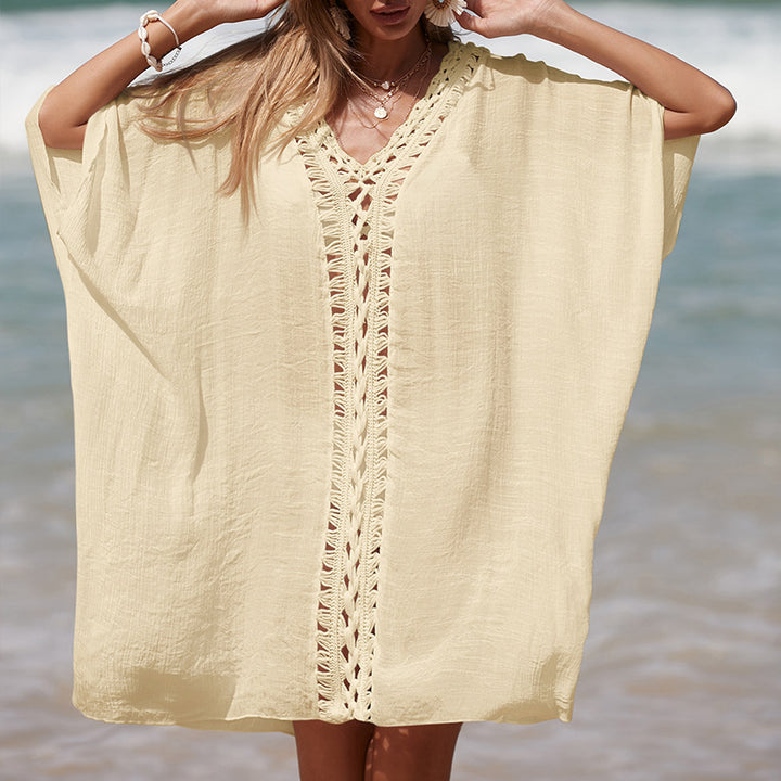 Damer elegant strandponcho med raffinerade virkadetaljer och djup V-urringning Mirla-Eva Jonsson