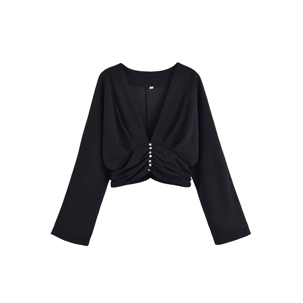 Damer elegant topp med djup V-ringning och raffinerad volangdesign Mirla-Eva Jonsson