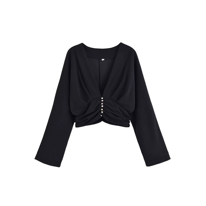 Damer elegant topp med djup V-ringning och raffinerad volangdesign Mirla-Eva Jonsson