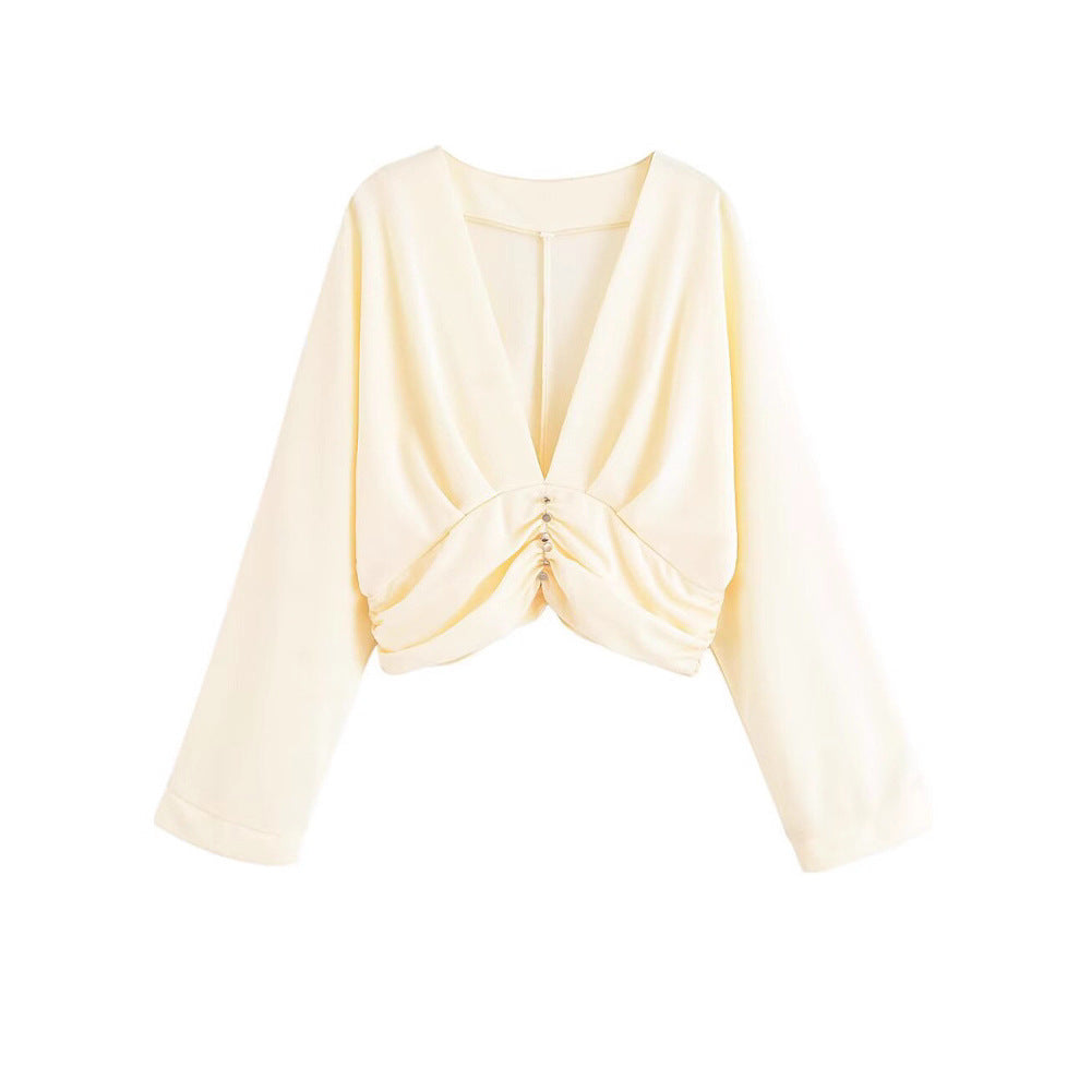 Damer elegant topp med djup V-ringning och raffinerad volangdesign Mirla-Eva Jonsson