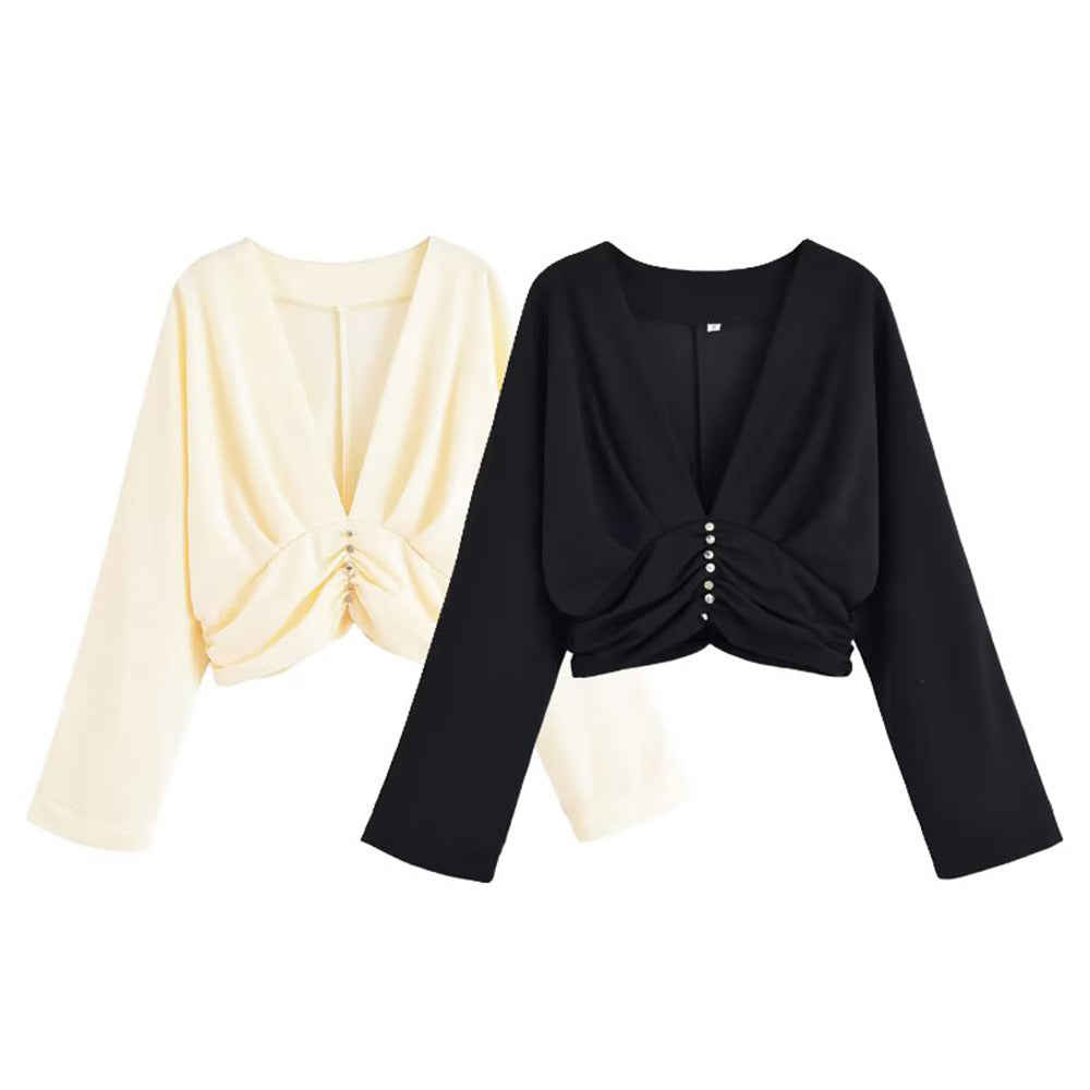 Damer elegant topp med djup V-ringning och raffinerad volangdesign Mirla-Eva Jonsson