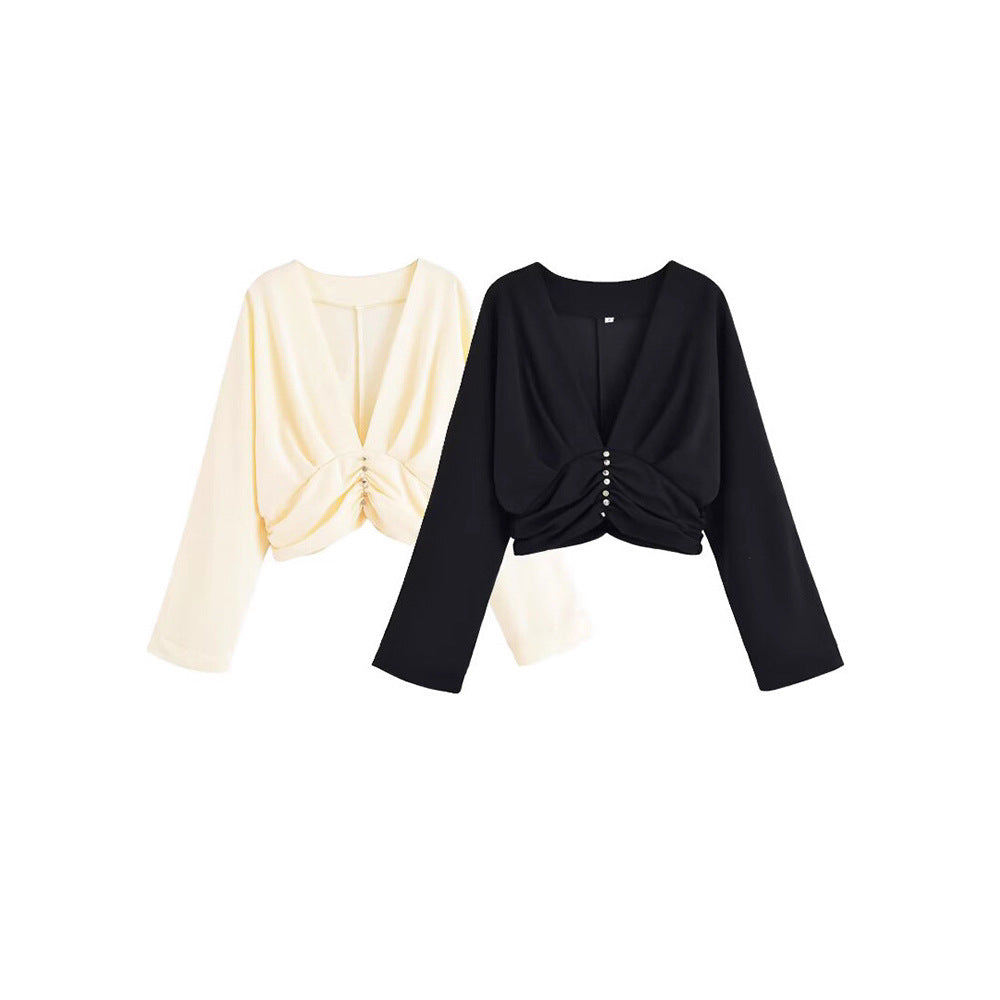 Damer elegant topp med djup V-ringning och raffinerad volangdesign Mirla-Eva Jonsson