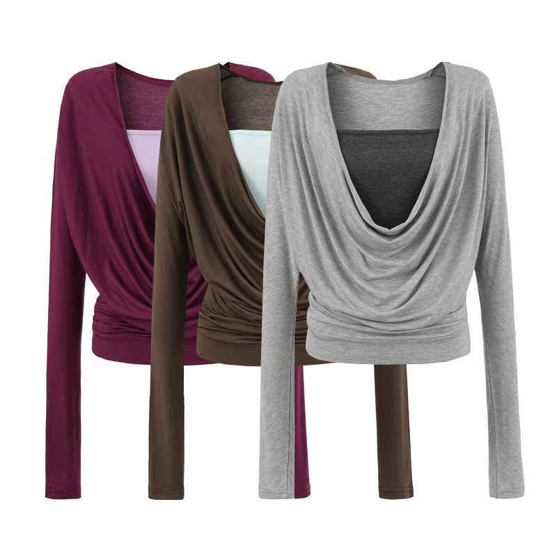 Damer elegant topp med raffinerad drapering och djup V-ringning Mirla-Eva Jonsson