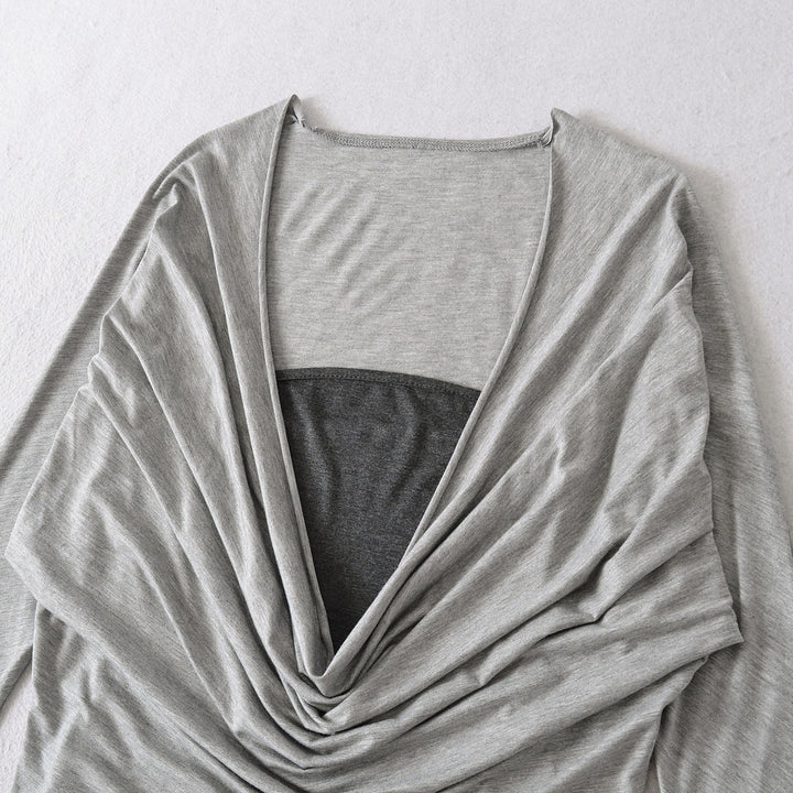 Damer elegant topp med raffinerad drapering och djup V-ringning Mirla-Eva Jonsson