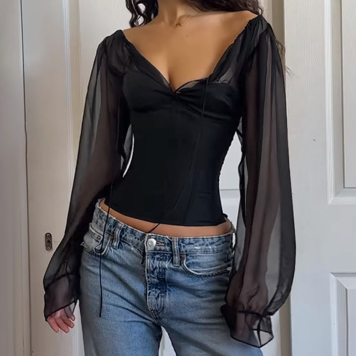 Damer elegant topp med transparenta ärmar och smal silhuett Mirla-Eva Jonsson