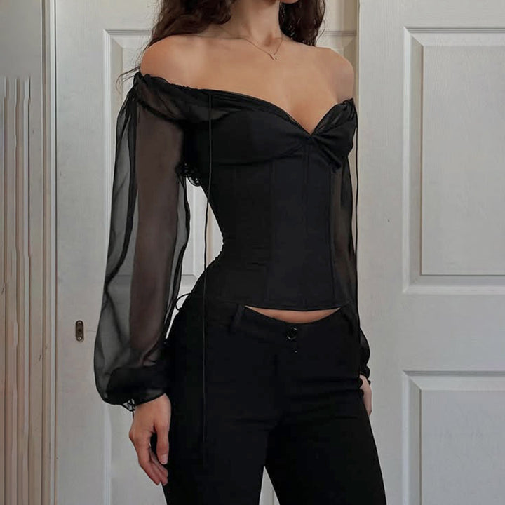 Damer elegant topp med transparenta ärmar och smal silhuett Mirla-Eva Jonsson