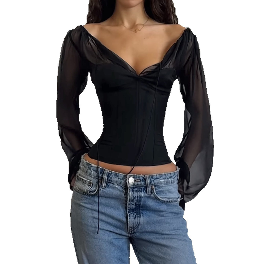 Damer elegant topp med transparenta ärmar och smal silhuett Mirla-Eva Jonsson