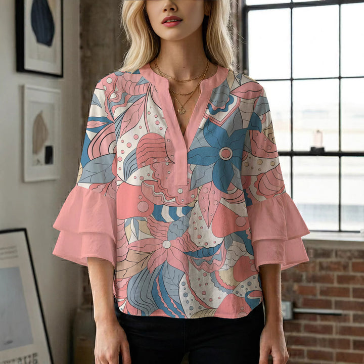 Damer elegant topp med voluminösa rynkade kanter och blommönster Mirla-Eva Jonsson