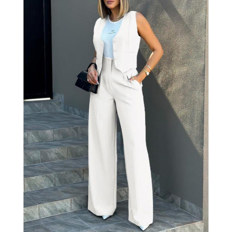 Damer elegant tvådelat set med löst skuren blazer och hög midja byxa Mirla-Eva Jonsson