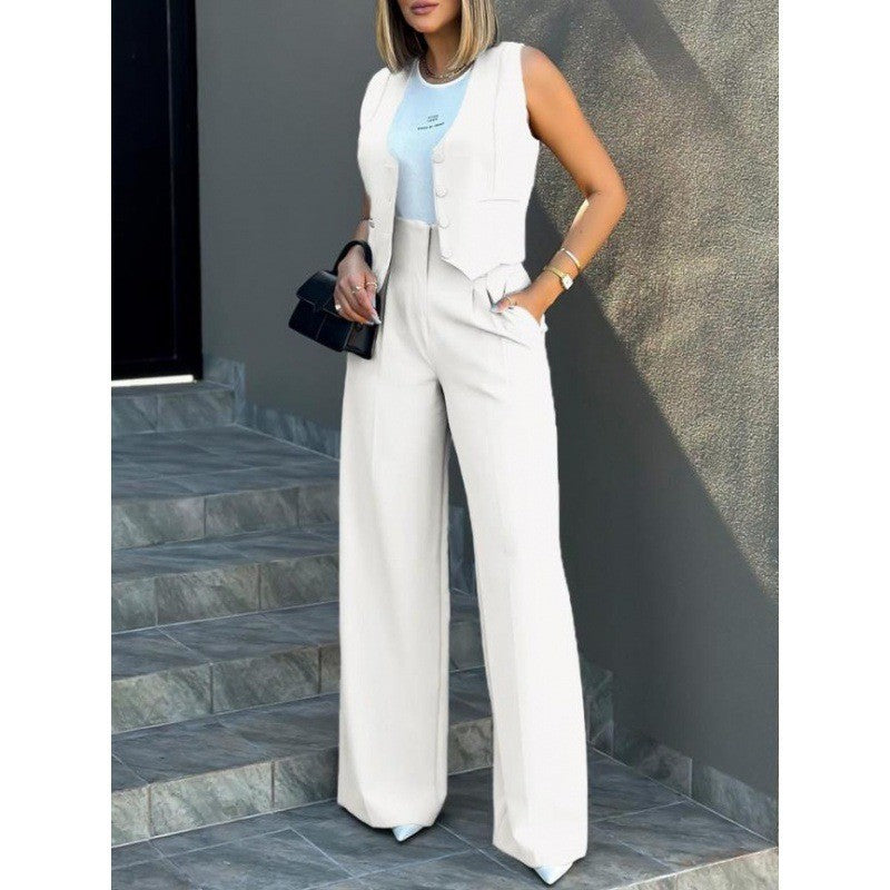 Damer elegant tvådelat set med löst skuren blazer och hög midja byxa Mirla-Eva Jonsson
