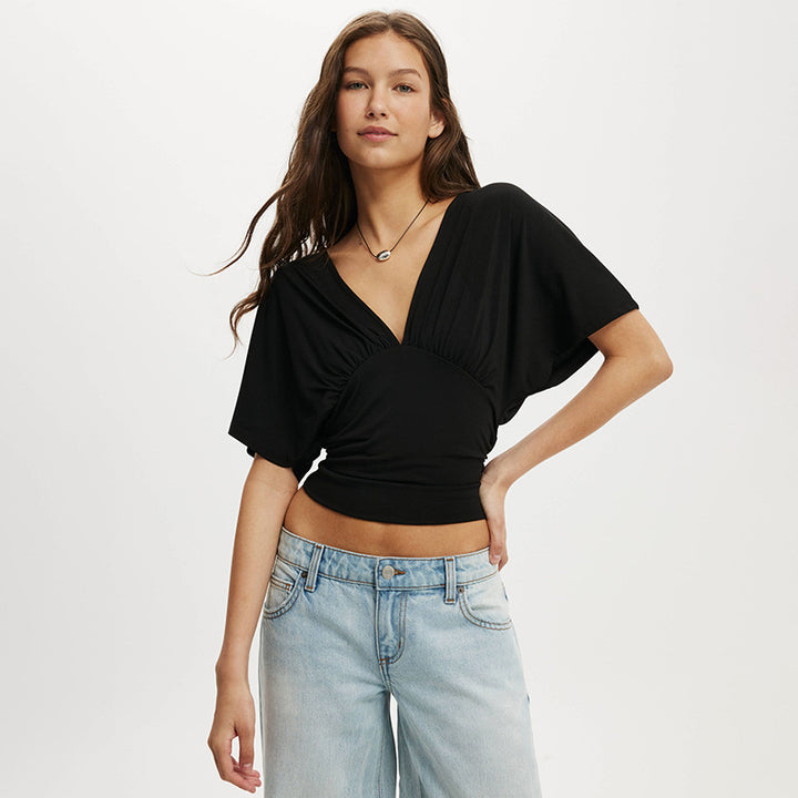 Damer elegant wrap-overdel med voluminösa ärmar och djup V-ringning Mirla-Eva Jonsson