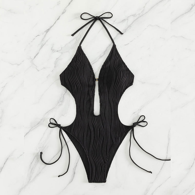 Damer en del baddräkt med modernt cut-out och elastisk draperingsdetalj Mirla-Eva Jonsson