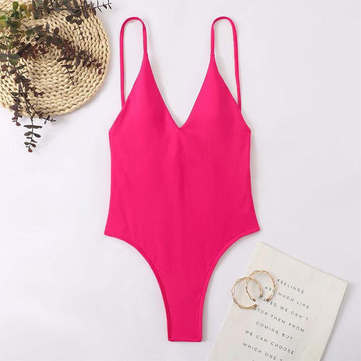 Damer enstyck baddräkt med djup V-ringning och smala spaghettistilar Mirla-Eva Jonsson