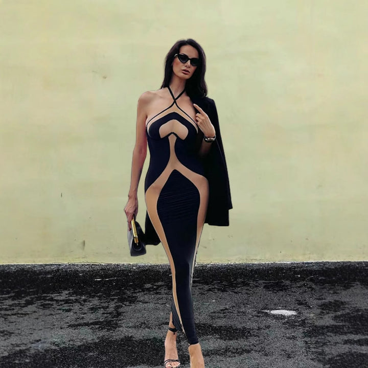 Damer figurnära aftonklänning med transparenta insatser och raffinerade cut-out-detaljer Mirla-Eva Jonsson