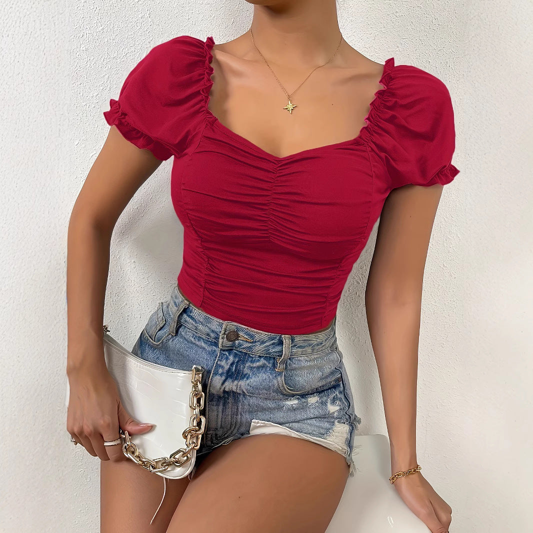 Damer figurnära crop-top med puffsleeves och rynkning Mirla-Eva Jonsson