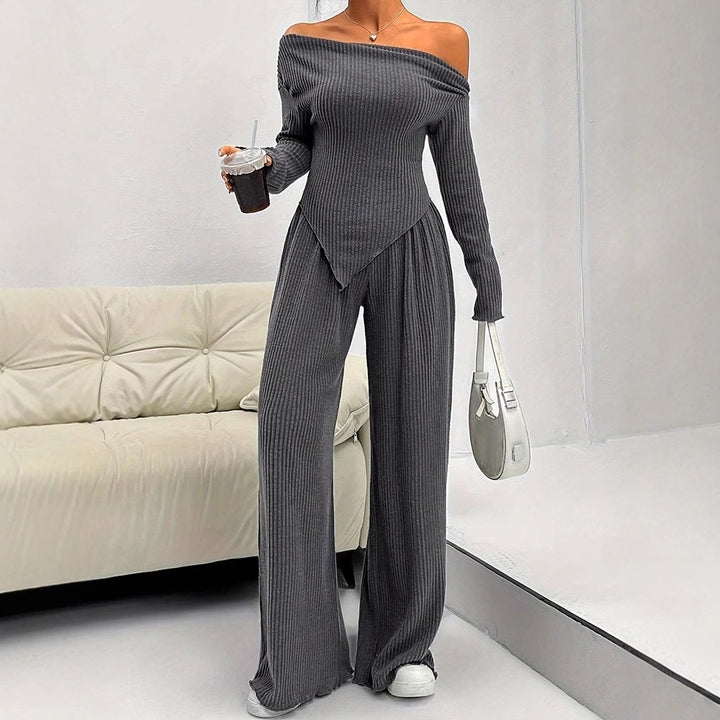Damer figurnära jumpsuit med asymmetrisk halsringning och långa ärmar Mirla-Eva Jonsson